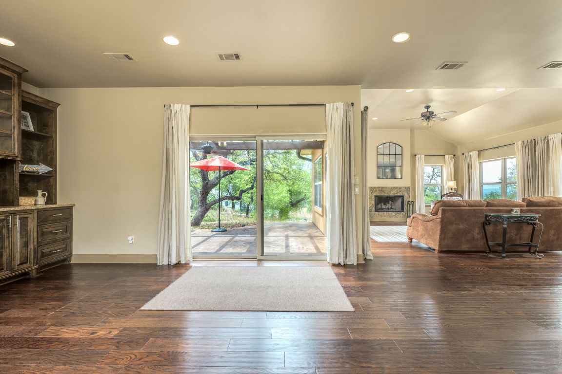 600 Mountain Dew Road Horseshoe Bay, TX 78657 - Photo 4 of 38 a living room with furniture window and wooden floor