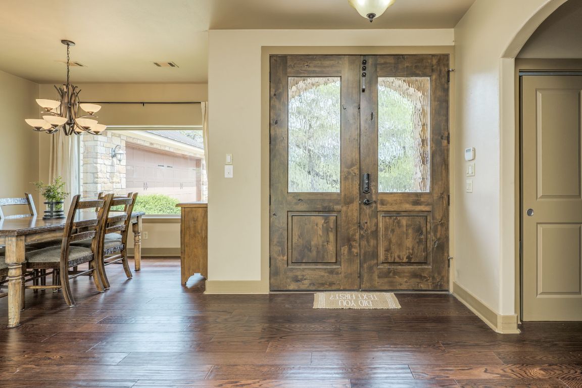 600 Mountain Dew Road Horseshoe Bay, TX 78657 - Photo 5 of 38 an empty room with wooden floor and windows