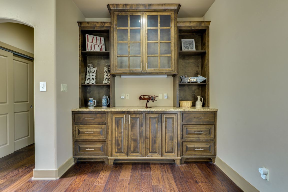 600 Mountain Dew Road Horseshoe Bay, TX 78657 - Photo 6 of 38 a kitchen with a wooden floor and a cabinet