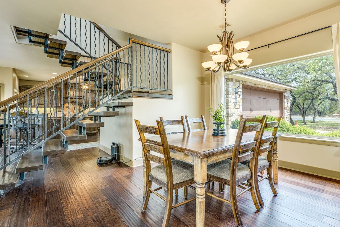 600 Mountain Dew Road Horseshoe Bay, TX 78657 - Photo 7 of 38 a view of a dining room with furniture window and wooden floor