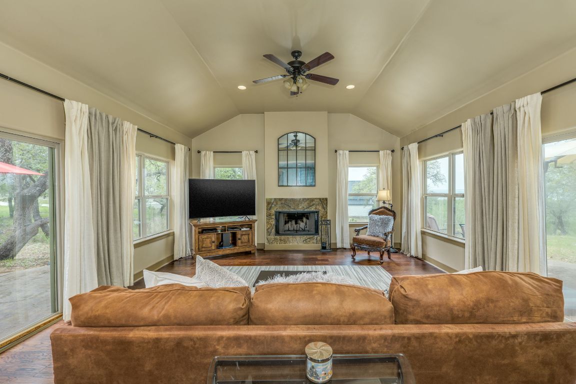 600 Mountain Dew Road Horseshoe Bay, TX 78657 - Photo 9 of 38 a living room with furniture and a large window