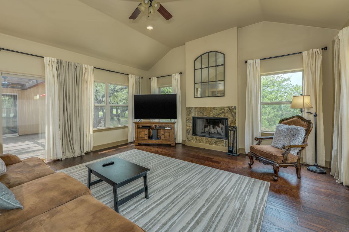 600 Mountain Dew Road Horseshoe Bay, TX 78657 - Photo 10 of 38 a living room with furniture and a fireplace