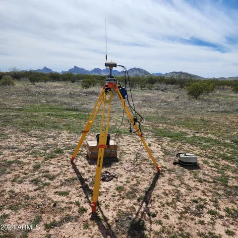 a view of a big yard with lots of green space