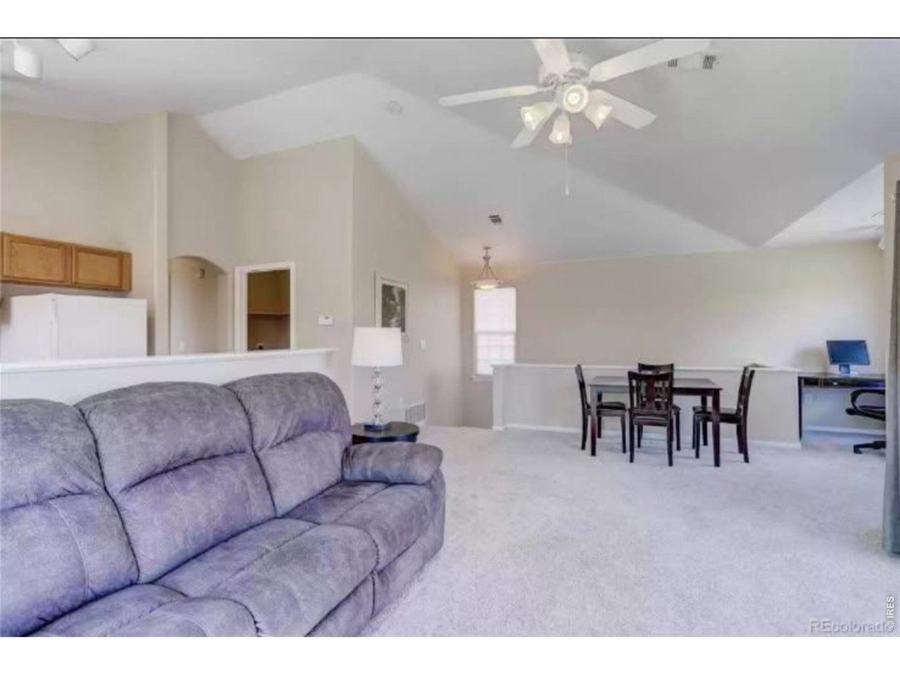 10381 Cook Way, Unit 206 Thornton, CO 80229 - Photo 6 of 39 Good sized living room with gas fireplace and sliding door to balcony.