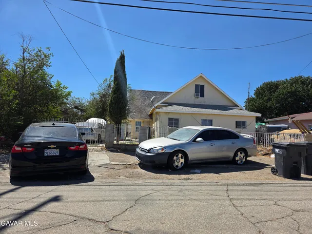 a front view of a house with parking space