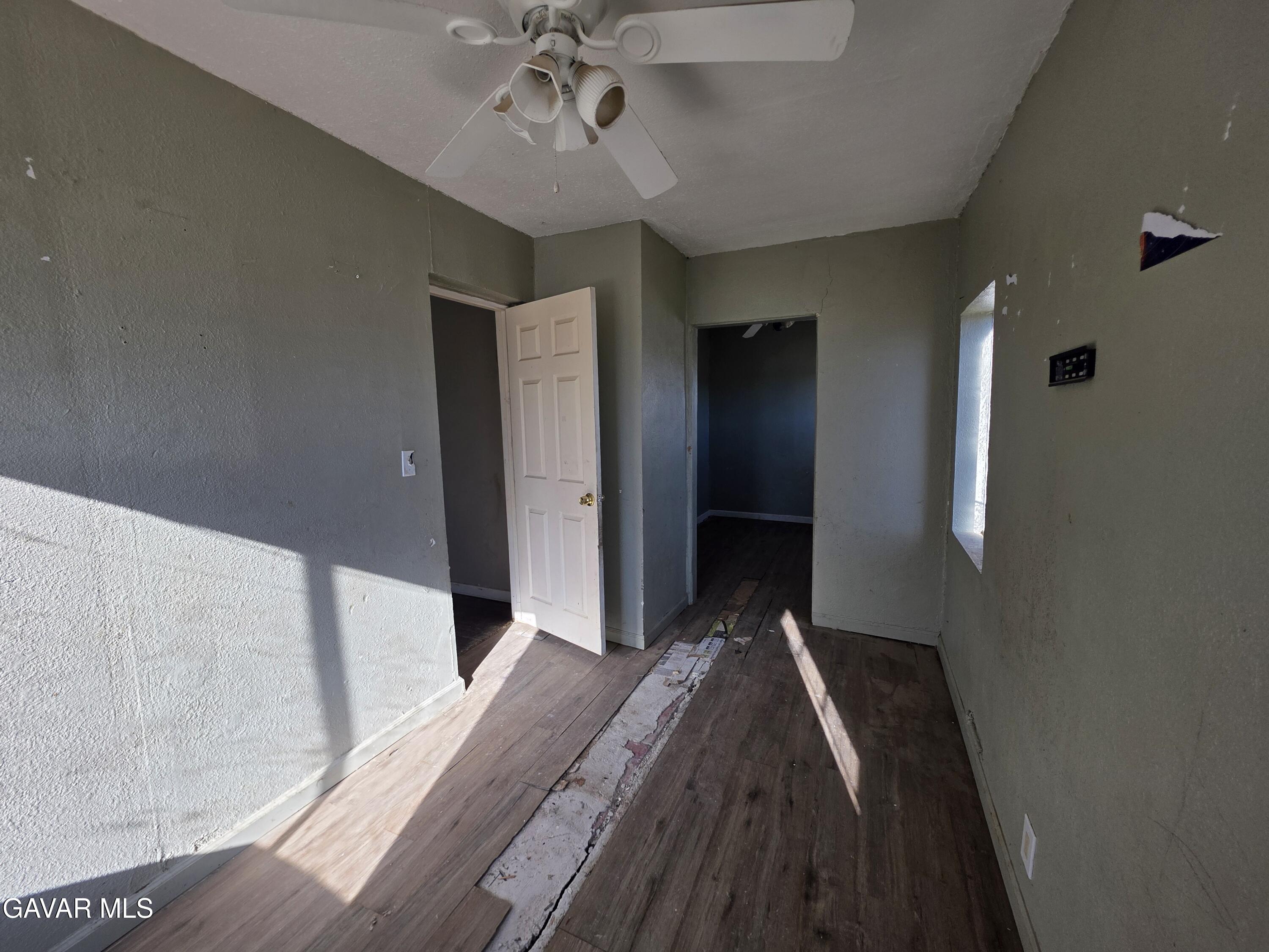 16133 I Street Mojave, CA 93501 - Photo 13 of 30 a view of a hallway to a bedroom