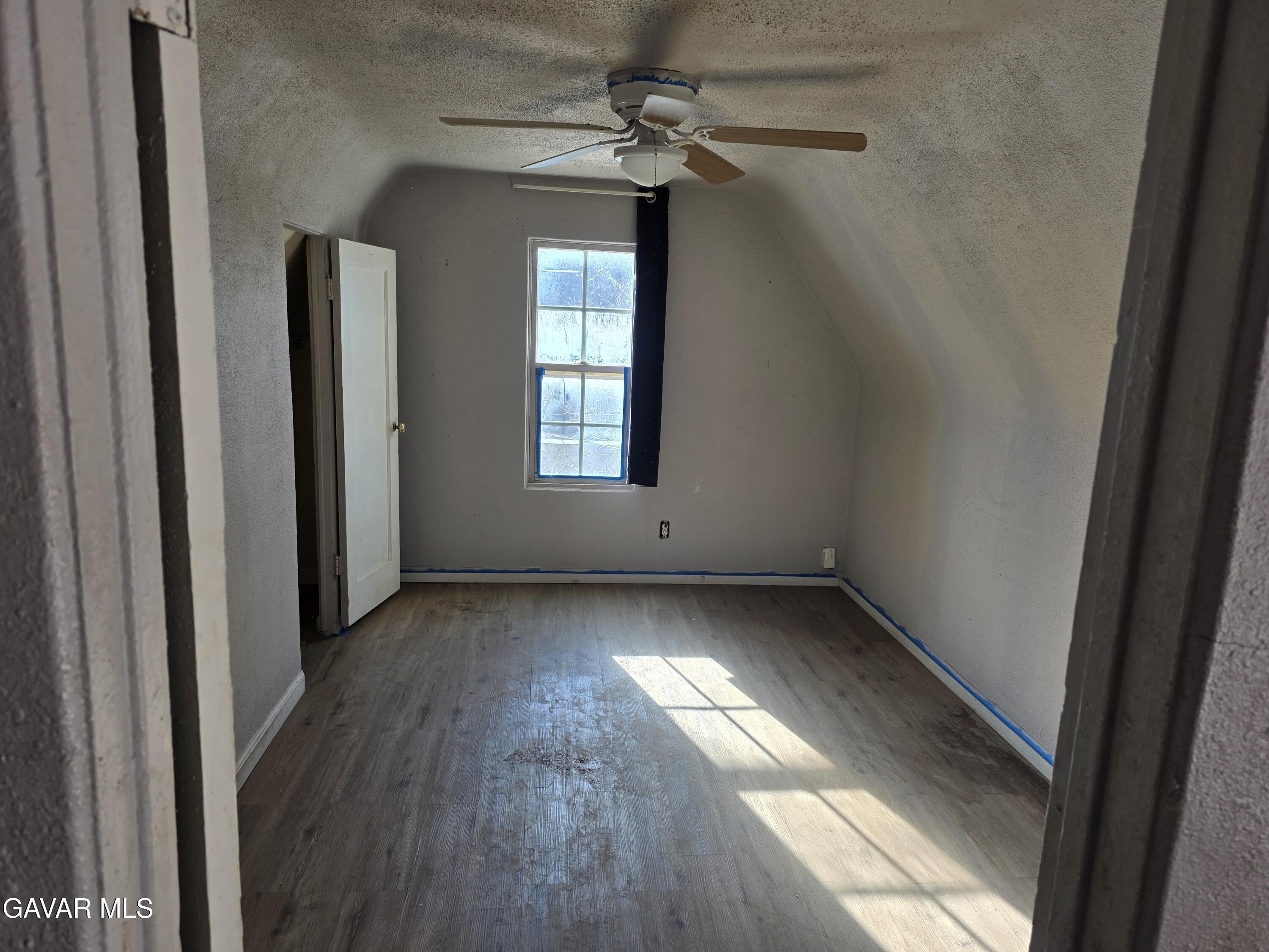 16133 I Street Mojave, CA 93501 - Photo 17 of 30 a view of a room with wooden floors and windows