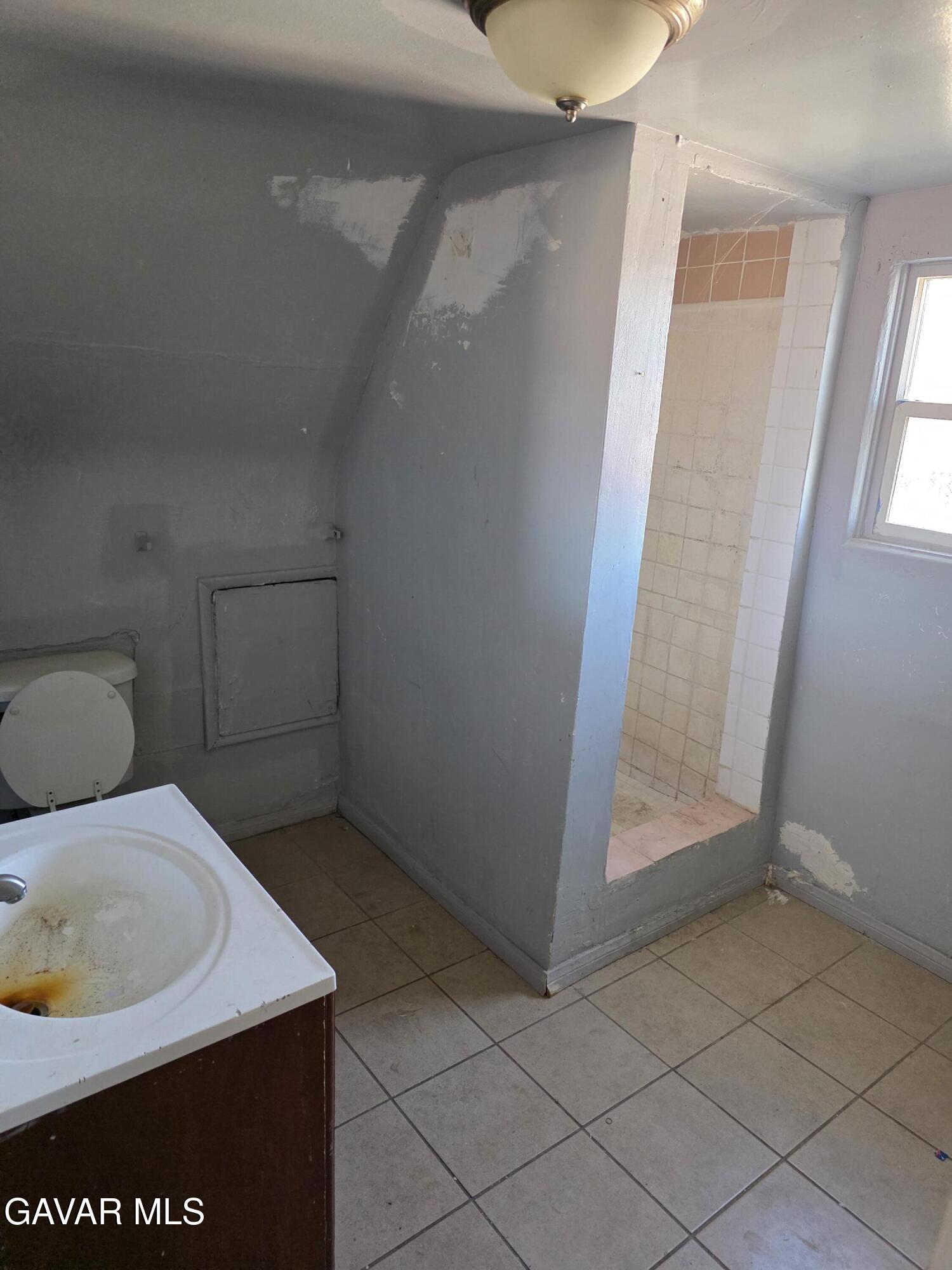 16133 I Street Mojave, CA 93501 - Photo 19 of 30 a bathroom with a sink and toilet