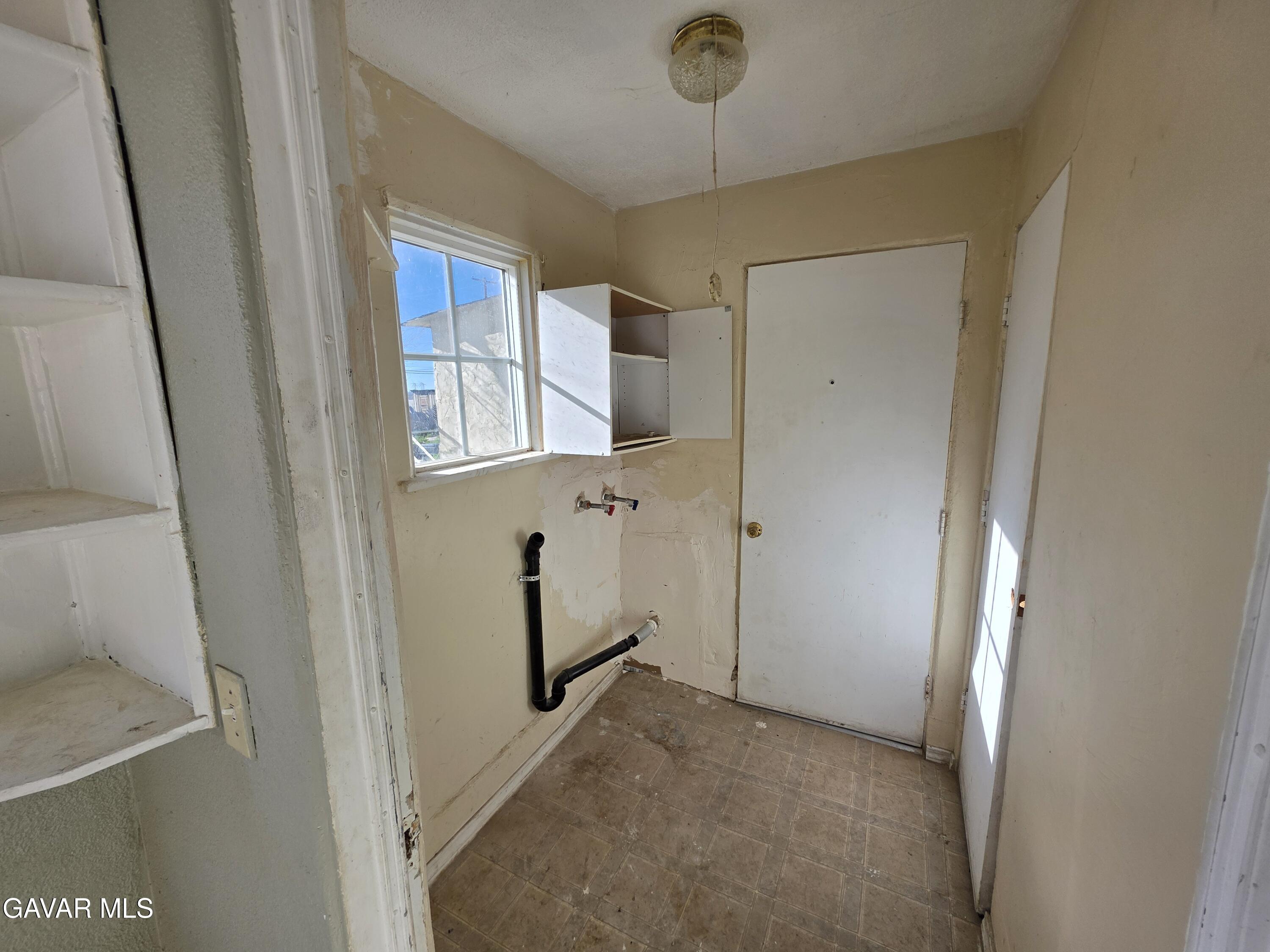 16133 I Street Mojave, CA 93501 - Photo 4 of 30 a view of a hallway to a room