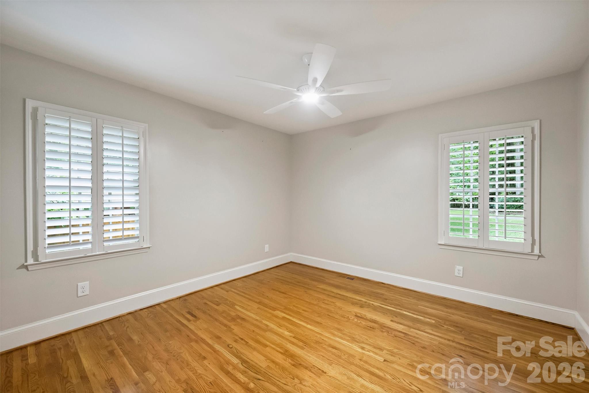 5519 Robinhood Road Charlotte, NC 28211 - Photo 37 of 46 a view of an empty room with wooden floor and a window