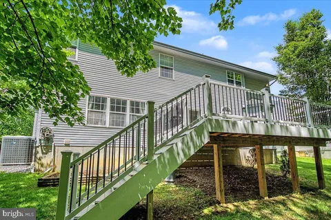 a front view of a house with a deck