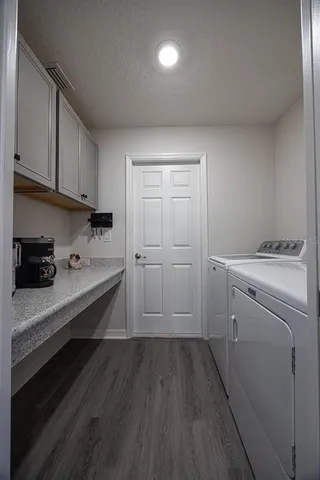 a bathroom with a granite countertop sink toilet and shower glass cabinet