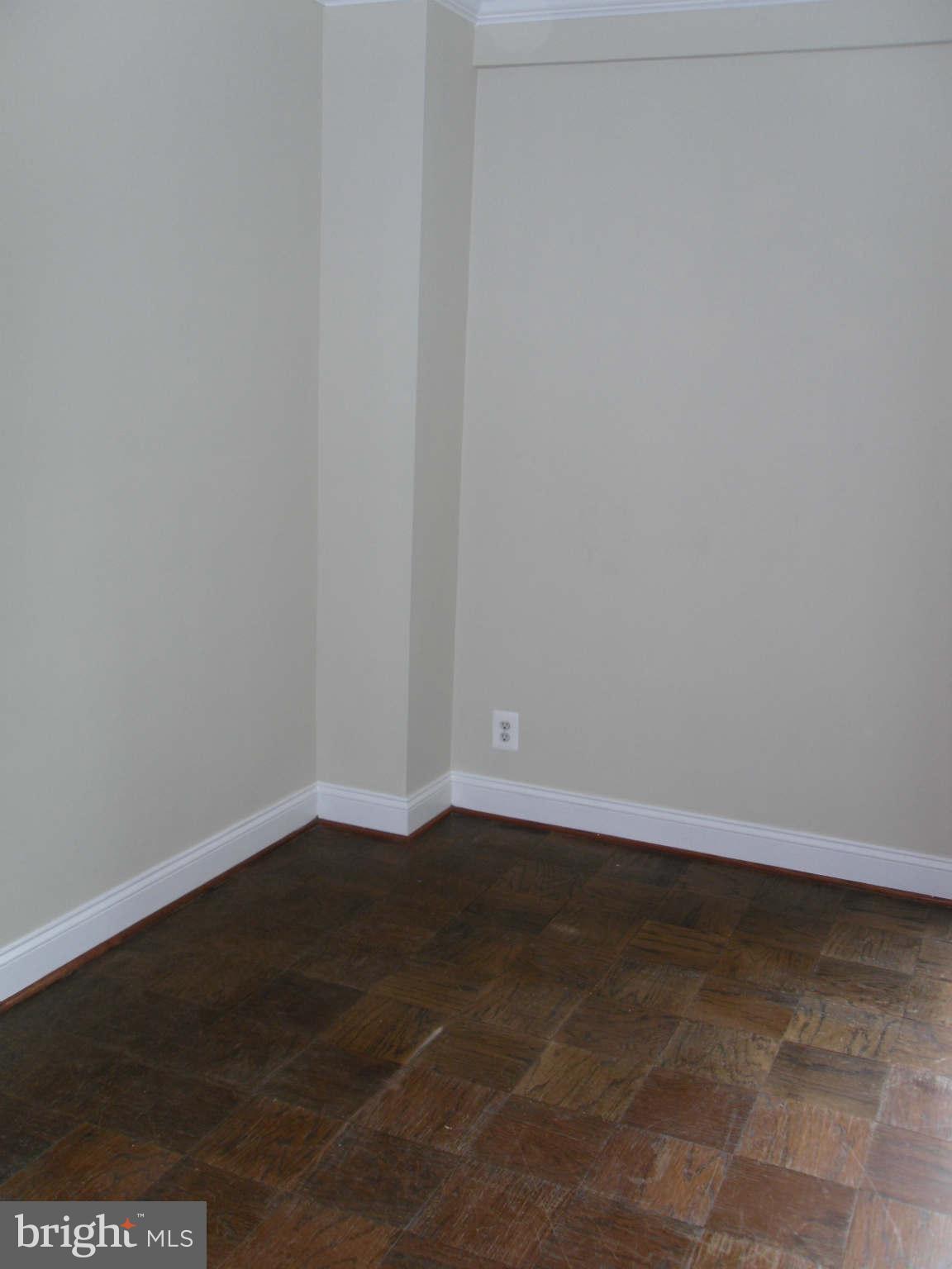 1435 4th Street Southwest, Unit B201 Washington, DC 20024 - Photo 7 of 22 a view of an empty room with wooden floor