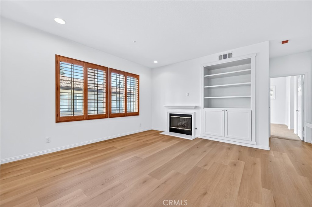 447 Ridgeway Irvine, CA 92620 - Photo 20 of 88 a view of an empty room with a fireplace and a window