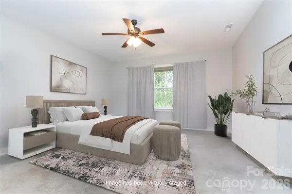 a bed room with a bed and a couch