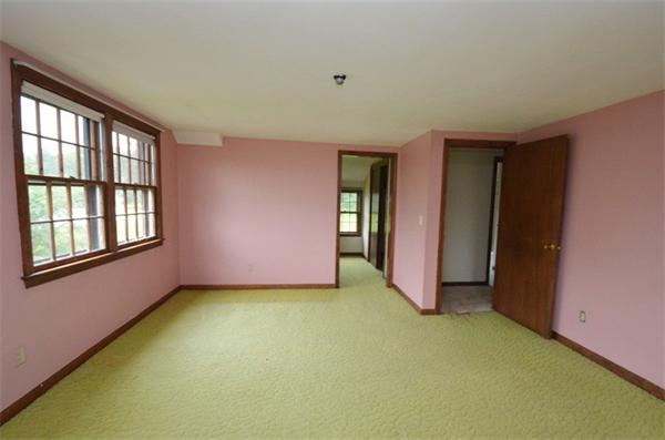 642 Wheeler Road Dracut, MA 01826 - Photo 14 of 30 a view of an empty room with closet and a window