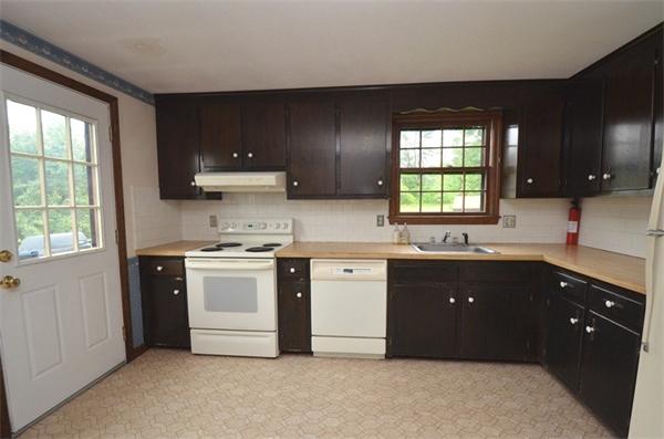 642 Wheeler Road Dracut, MA 01826 - Photo 2 of 30 a kitchen with a sink and a stove top oven