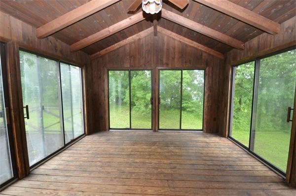 642 Wheeler Road Dracut, MA 01826 - Photo 23 of 30 a view of an empty room with wooden floor and a balcony