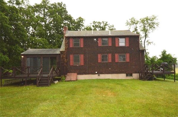 642 Wheeler Road Dracut, MA 01826 - Photo 25 of 30 front view of a house with a yard