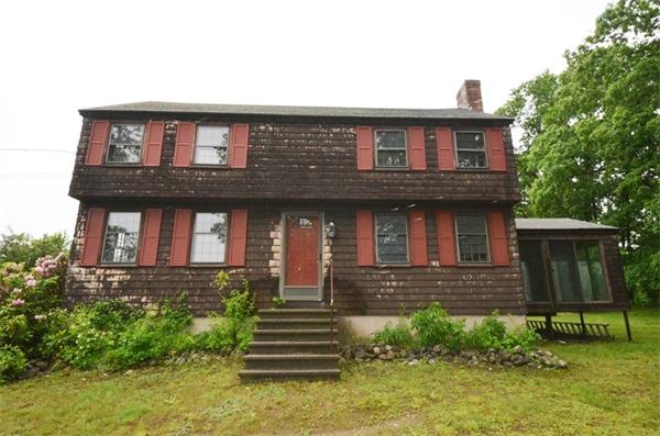 642 Wheeler Road Dracut, MA 01826 - Photo 26 of 30 a front view of a house with a garden