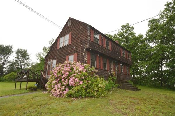 642 Wheeler Road Dracut, MA 01826 - Photo 27 of 30 a front view of a house with a garden