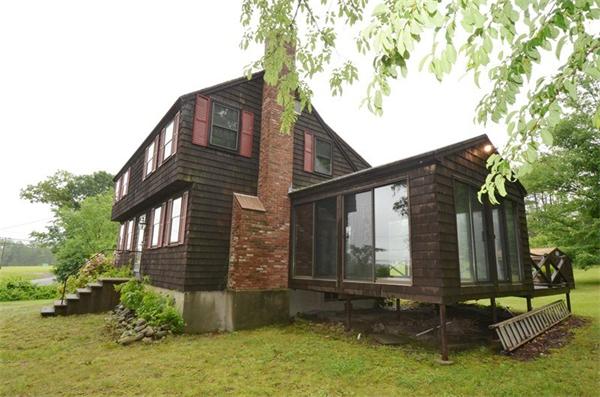 642 Wheeler Road Dracut, MA 01826 - Photo 29 of 30 a backyard of a house with lots of green space