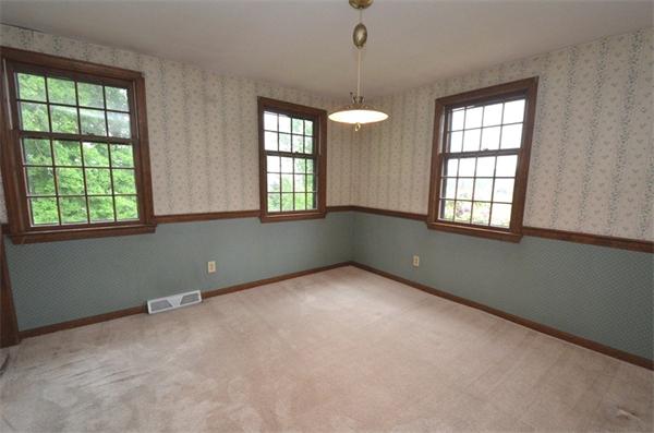642 Wheeler Road Dracut, MA 01826 - Photo 4 of 30 an empty room with windows