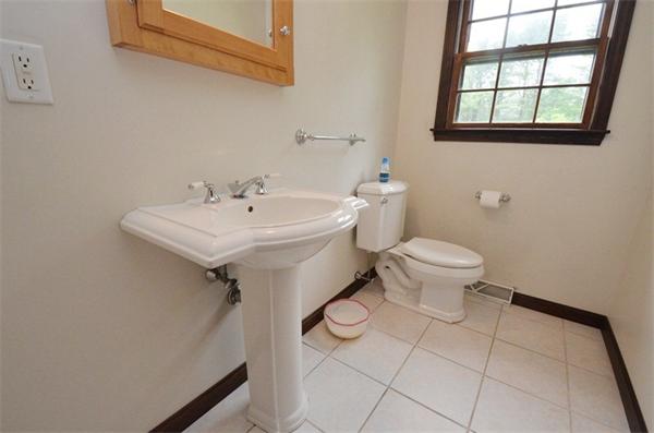 642 Wheeler Road Dracut, MA 01826 - Photo 10 of 30 a bathroom with a sink toilet and a window