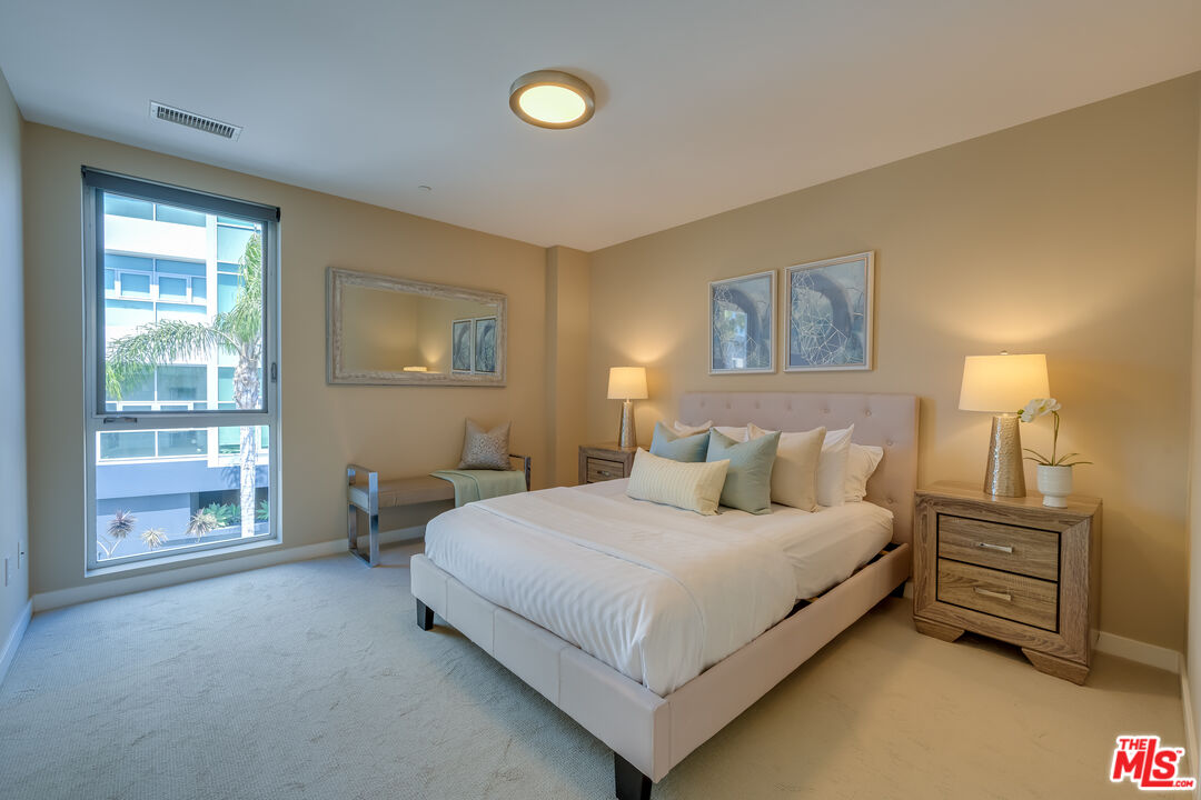 310 Washington Boulevard, Unit 802 Marina del Rey, CA 90292 - Photo 18 of 43 a bedroom with a bed and a tv