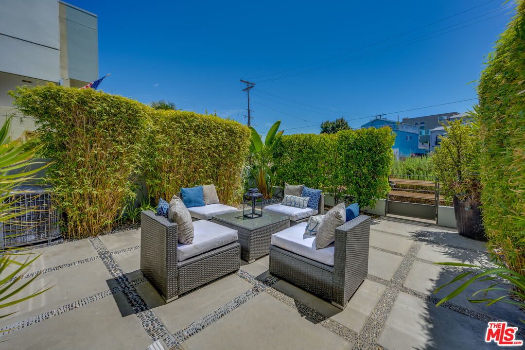 310 Washington Boulevard, Unit 802 Marina del Rey, CA 90292 - Photo 2 of 43 a view of a patio with couches and potted plants