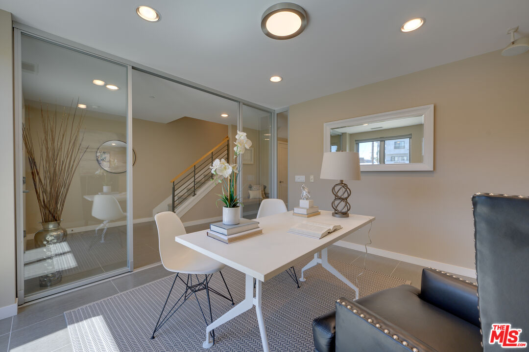 310 Washington Boulevard, Unit 802 Marina del Rey, CA 90292 - Photo 23 of 43 a view of a dining room with furniture and wooden floor