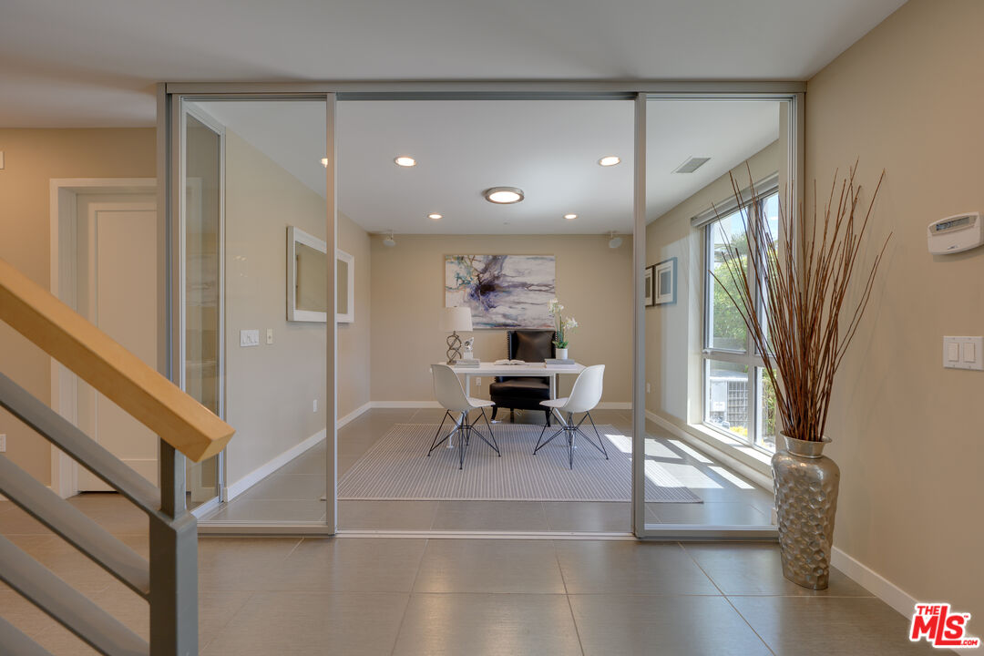 310 Washington Boulevard, Unit 802 Marina del Rey, CA 90292 - Photo 24 of 43 a view of dining room with wooden floor and furniture