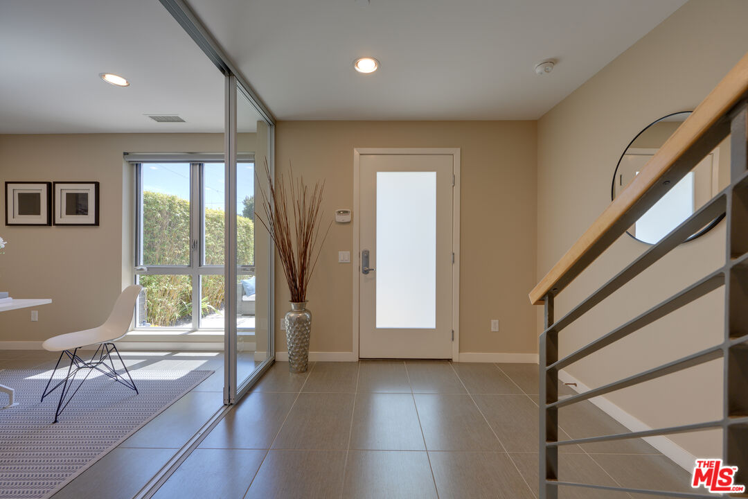 310 Washington Boulevard, Unit 802 Marina del Rey, CA 90292 - Photo 27 of 43 a view of an entryway with wooden floor and door