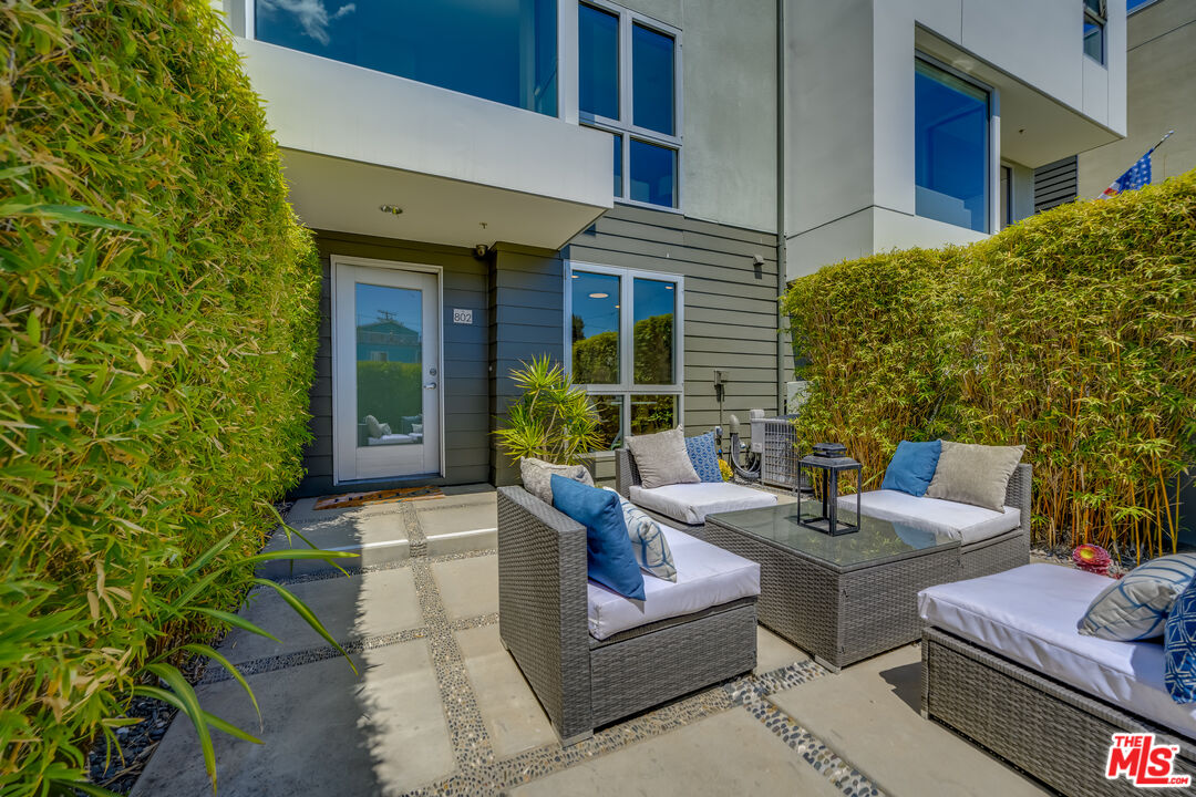 310 Washington Boulevard, Unit 802 Marina del Rey, CA 90292 - Photo 28 of 43 a view of a patio with couches table and chairs and potted plants