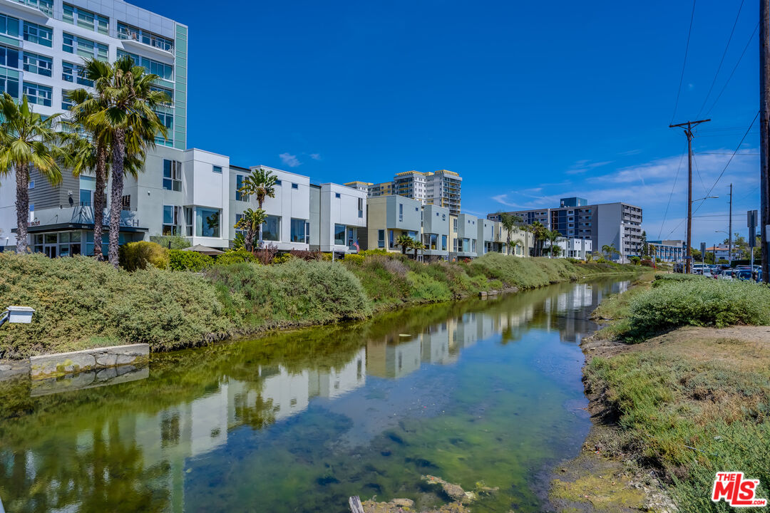 310 Washington Boulevard, Unit 802 Marina del Rey, CA 90292 - Photo 34 of 43 a view of a lake with a house in the background