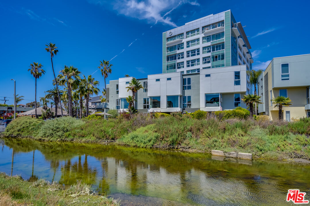 310 Washington Boulevard, Unit 802 Marina del Rey, CA 90292 - Photo 36 of 43 a large building with river in front of it