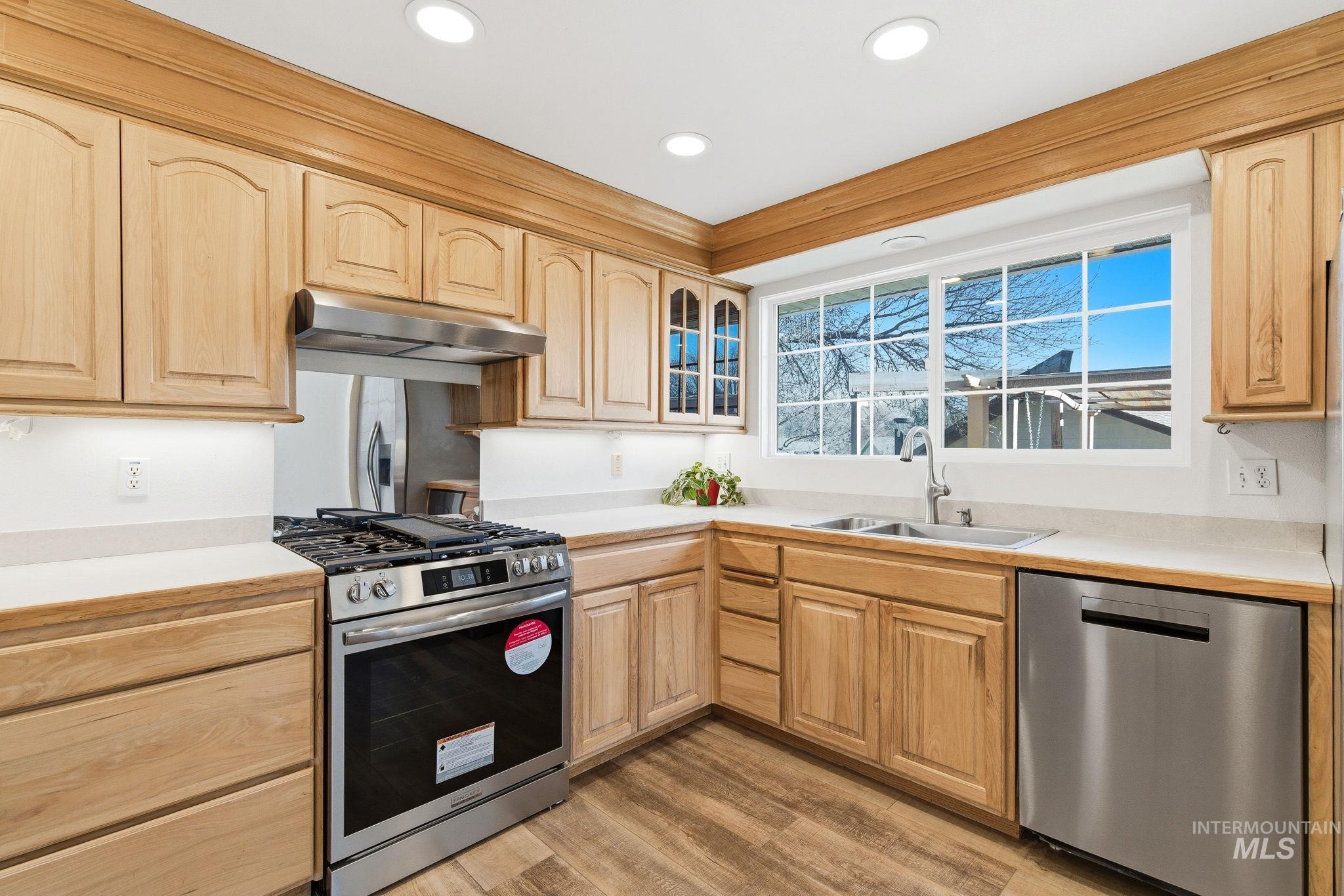 2072 South Crystal Way Boise, ID 83706 - Photo 15 of 50 Kitchen with stainless steel appliances, light countertops, light wood finish cabinets, and recessed lighting