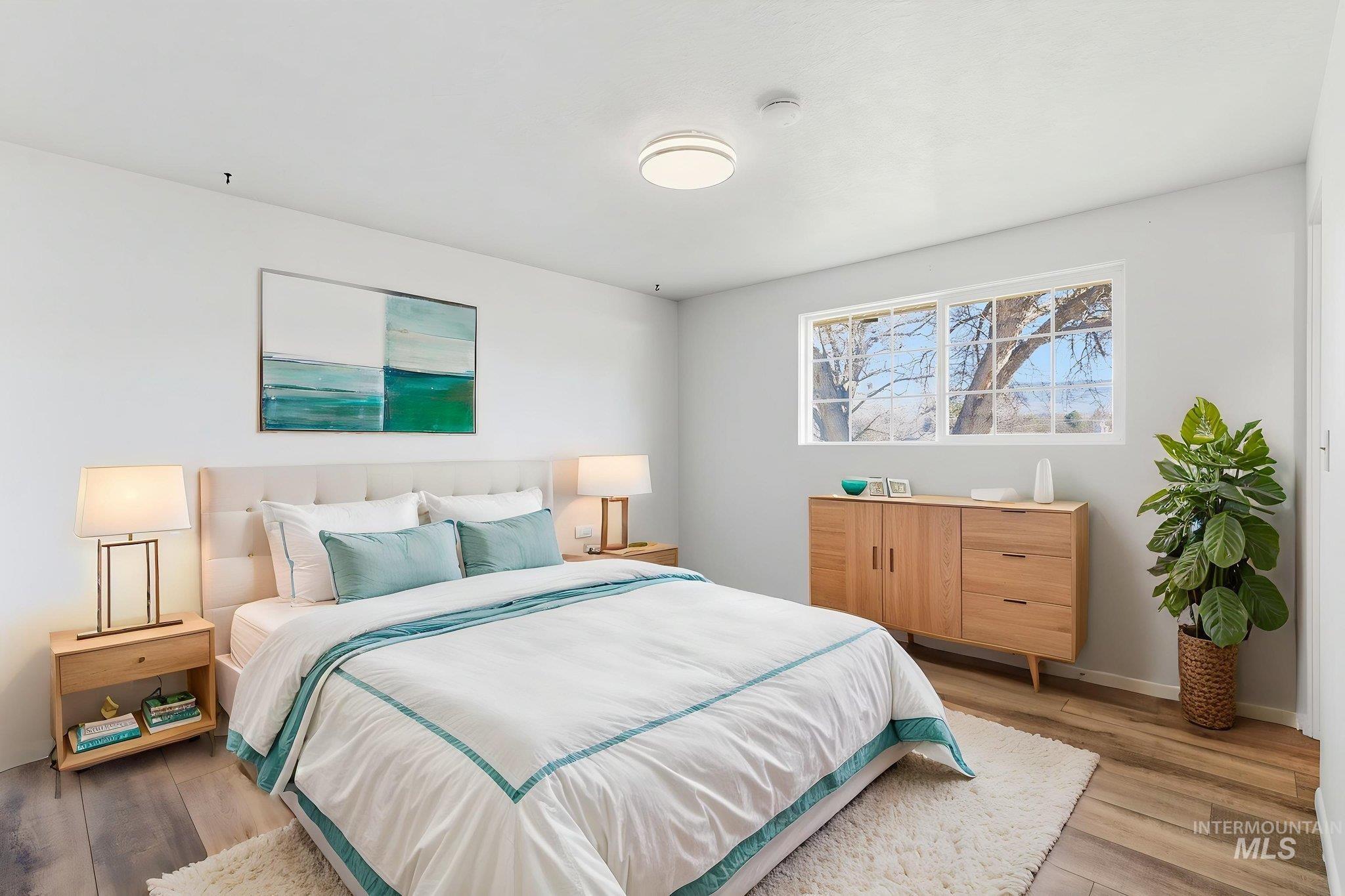 2072 South Crystal Way Boise, ID 83706 - Photo 20 of 50 Bedroom with light wood-type flooring and baseboards