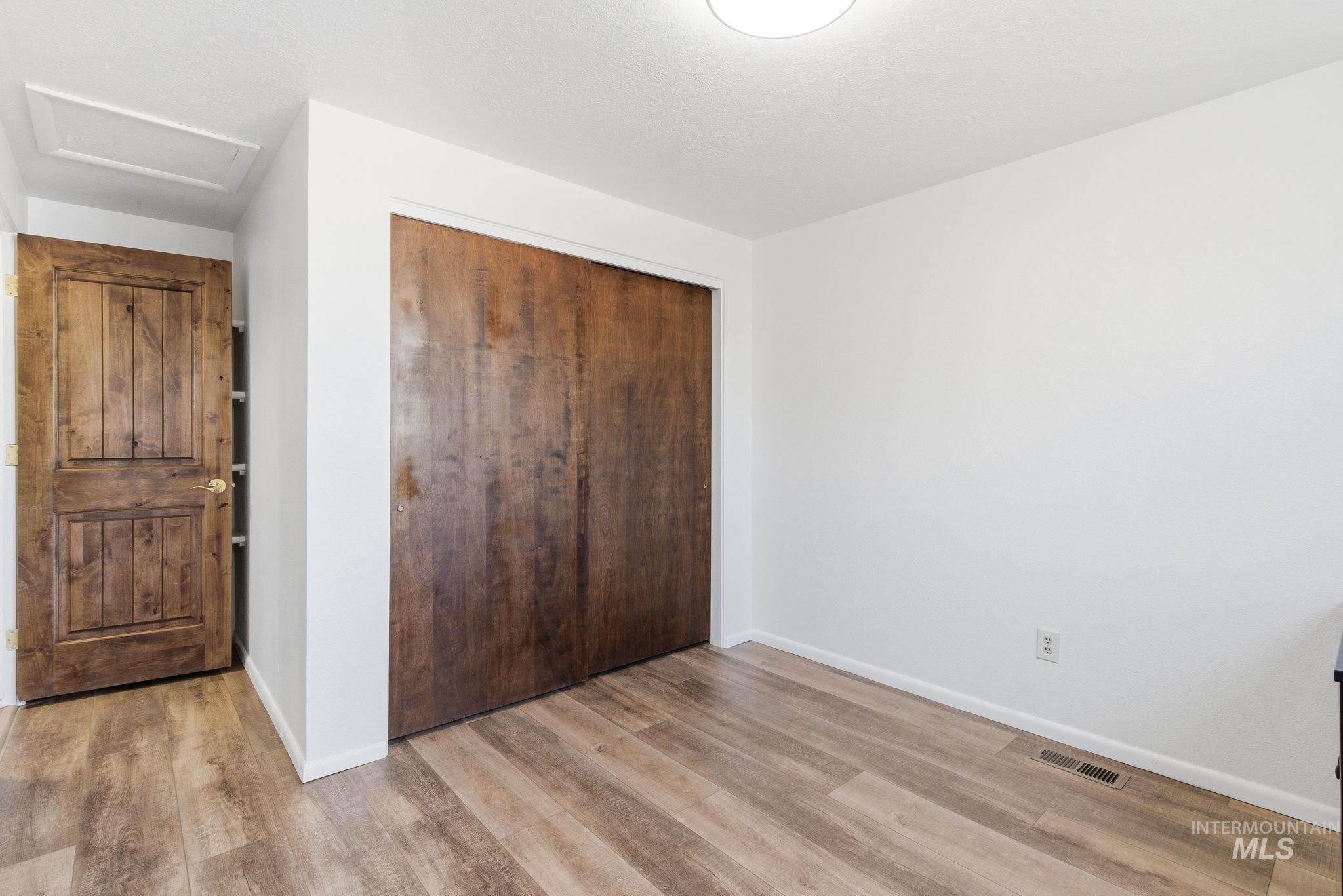 2072 South Crystal Way Boise, ID 83706 - Photo 22 of 50 Unfurnished bedroom featuring a closet and light wood-style floors