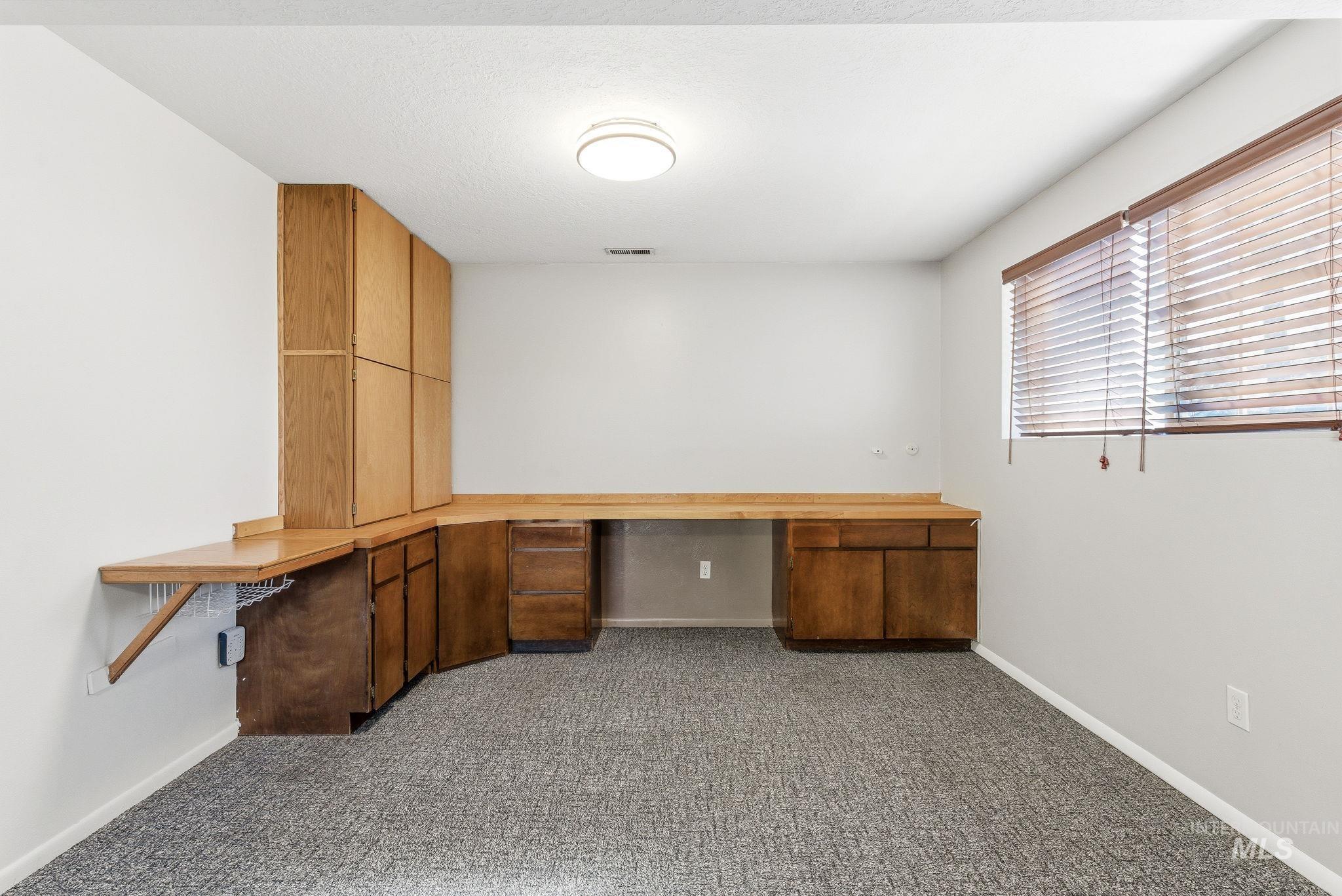 2072 South Crystal Way Boise, ID 83706 - Photo 27 of 50 Unfurnished office featuring built in desk and dark carpet