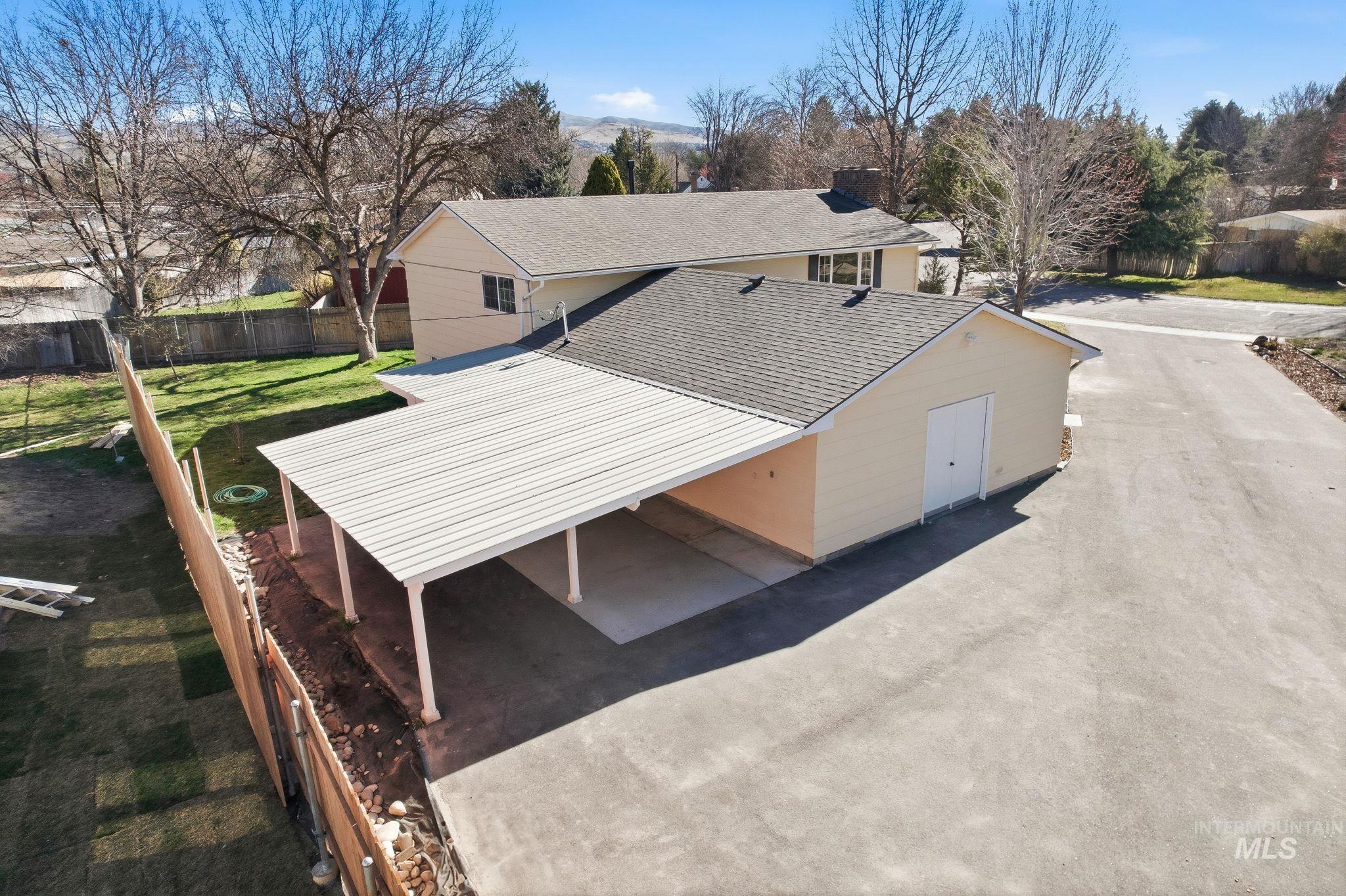 2072 South Crystal Way Boise, ID 83706 - Photo 3 of 50 View of front facade featuring a shingled roof and a carport