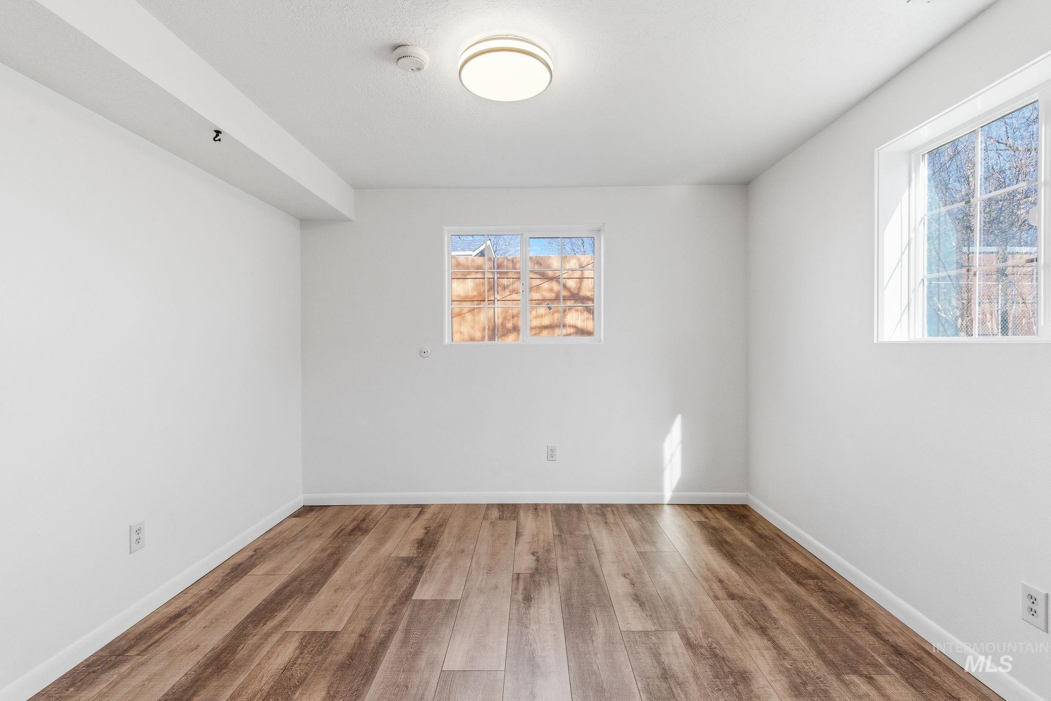 2072 South Crystal Way Boise, ID 83706 - Photo 32 of 50 Spare room featuring wood finished floors and baseboards
