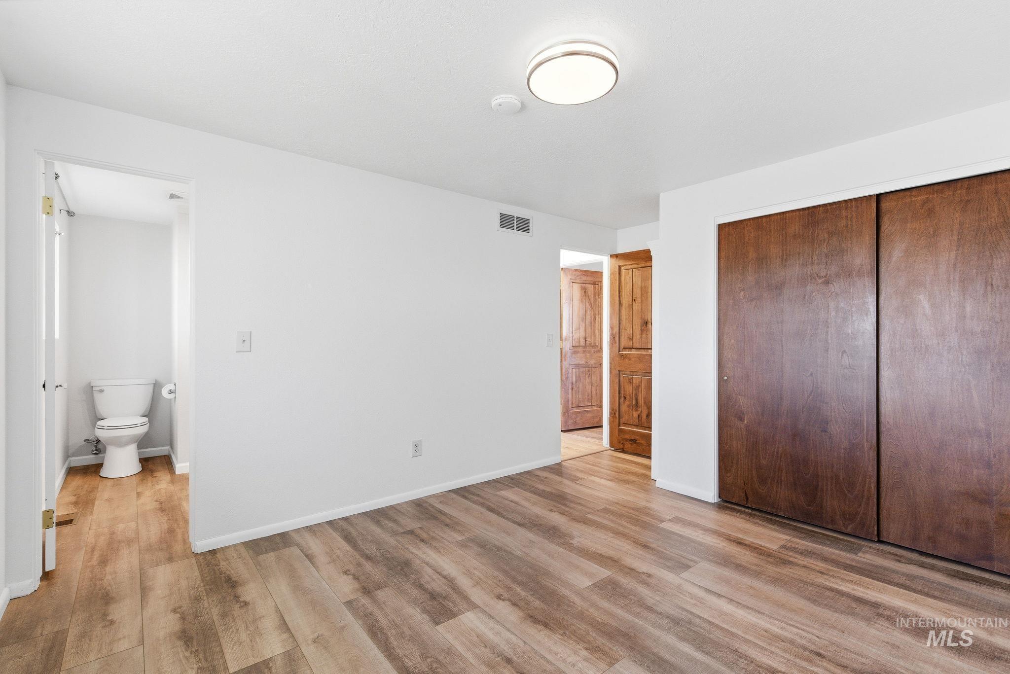 2072 South Crystal Way Boise, ID 83706 - Photo 36 of 50 Unfurnished bedroom with light wood-style flooring and a closet