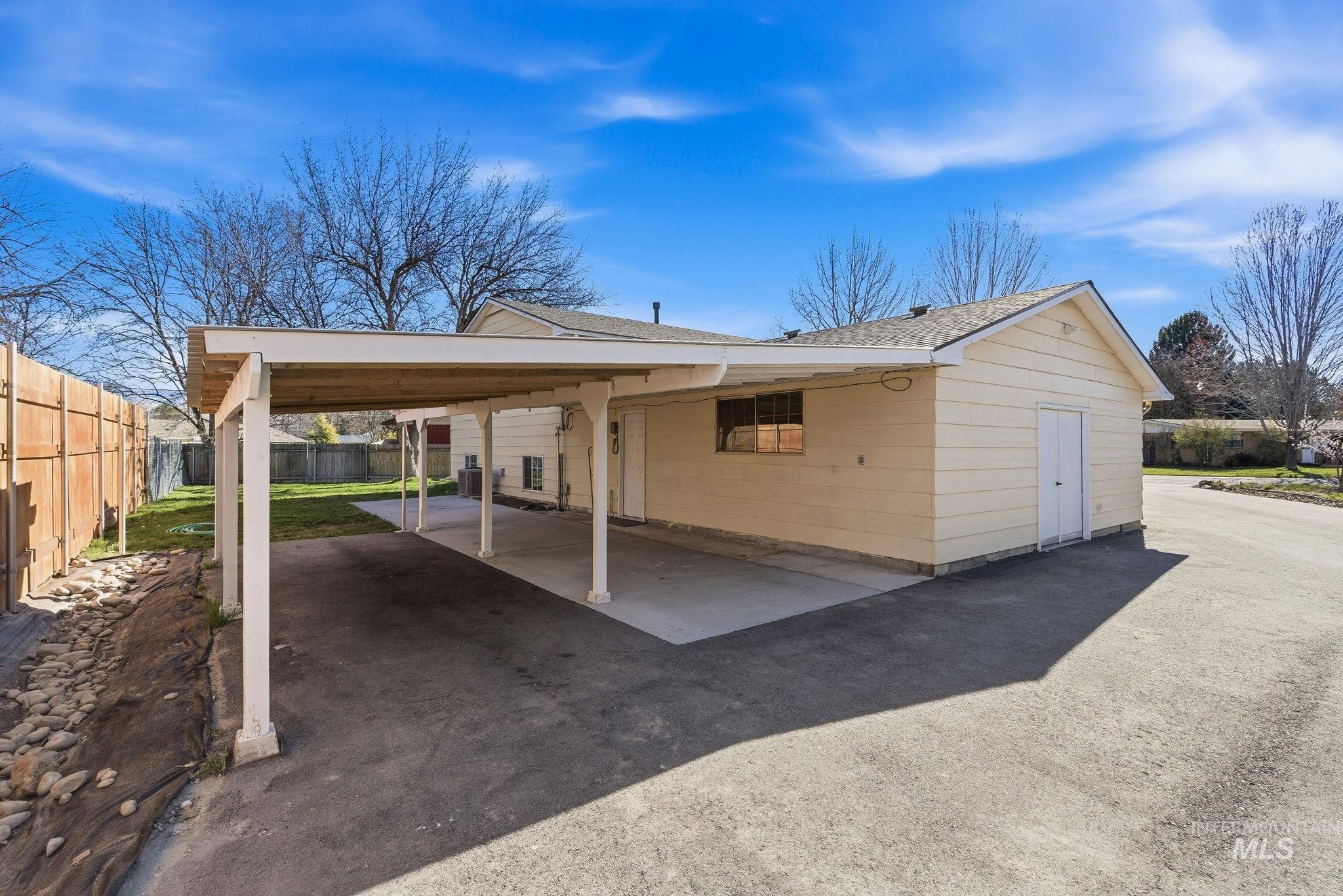 2072 South Crystal Way Boise, ID 83706 - Photo 44 of 50 View of front of home with a patio area, a carport, driveway, and roof with shingles