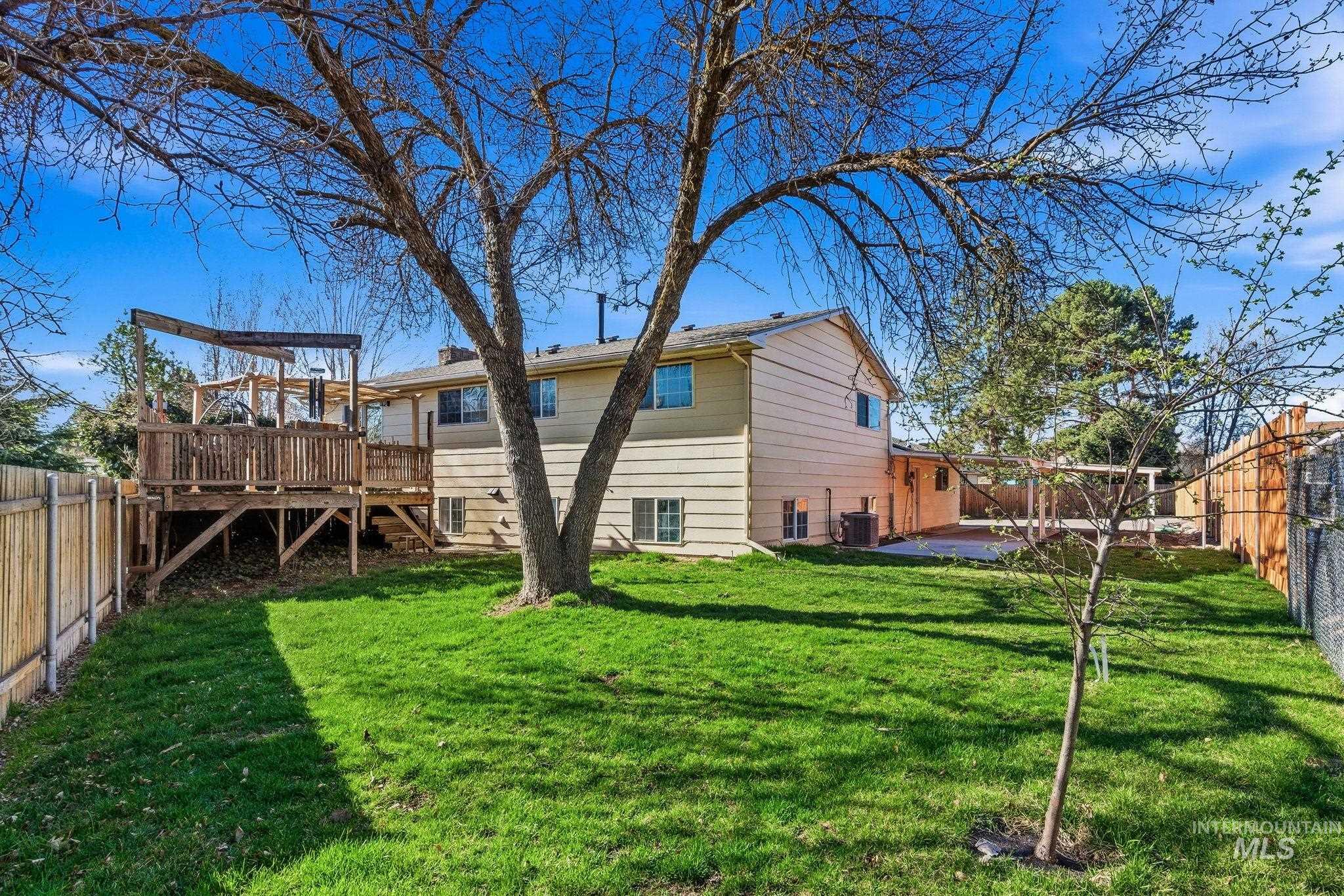 2072 South Crystal Way Boise, ID 83706 - Photo 48 of 50 Back of house with a fenced backyard and a deck