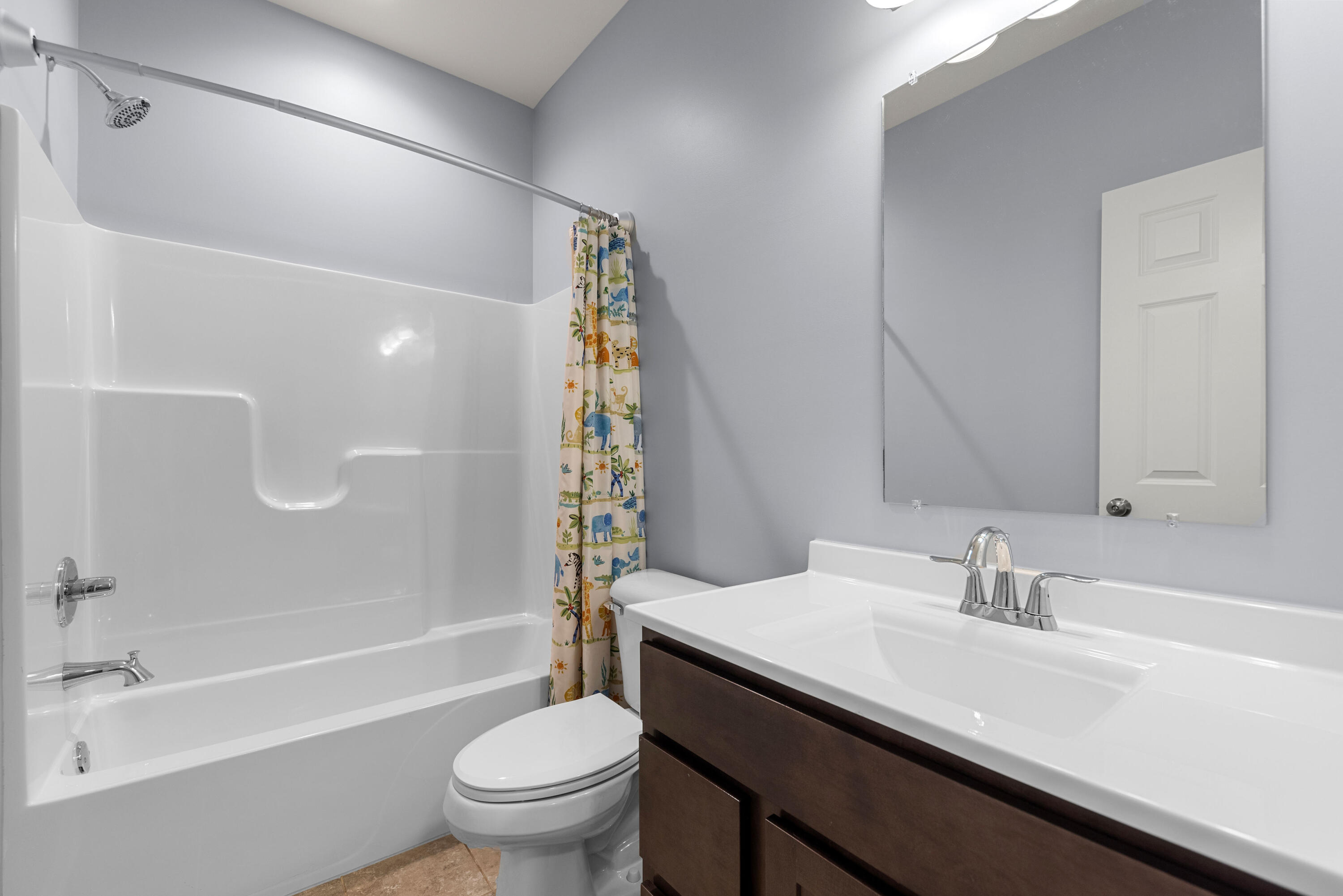 2451 Ritter Street Chesterton, IN 46304 - Photo 9 of 18 a bathroom with a sink a toilet and a large mirror