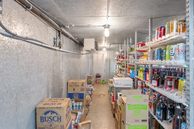 a utility room with lots of clutter and toys