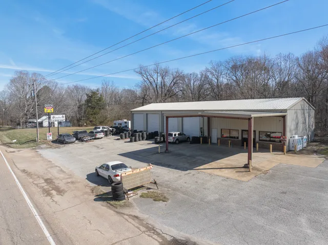 a swimming pool with outdoor seating and yard