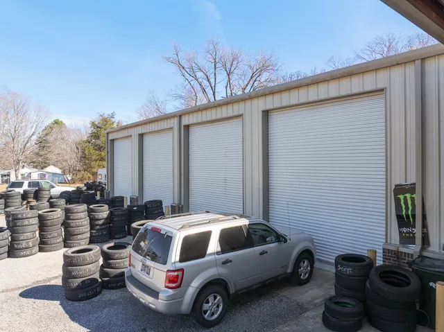 a car parked in front of white house