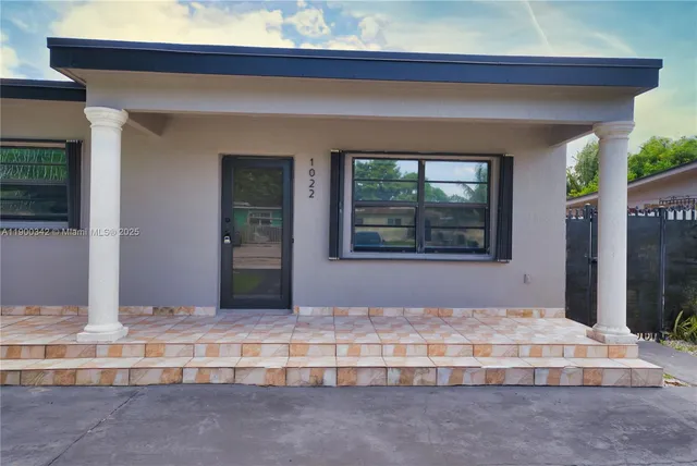 a bedroom with bed and a window